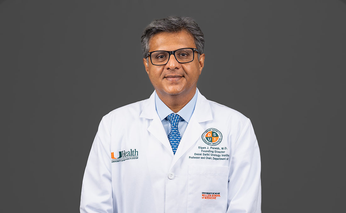 Dr. Dipen Parekh in white clinic coat