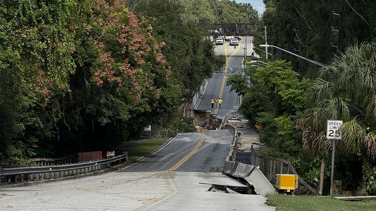 Parts of Limit Avenue collapsed during the storm near Donnelly Street. (Spectrum News 13/Camille Acevedo)