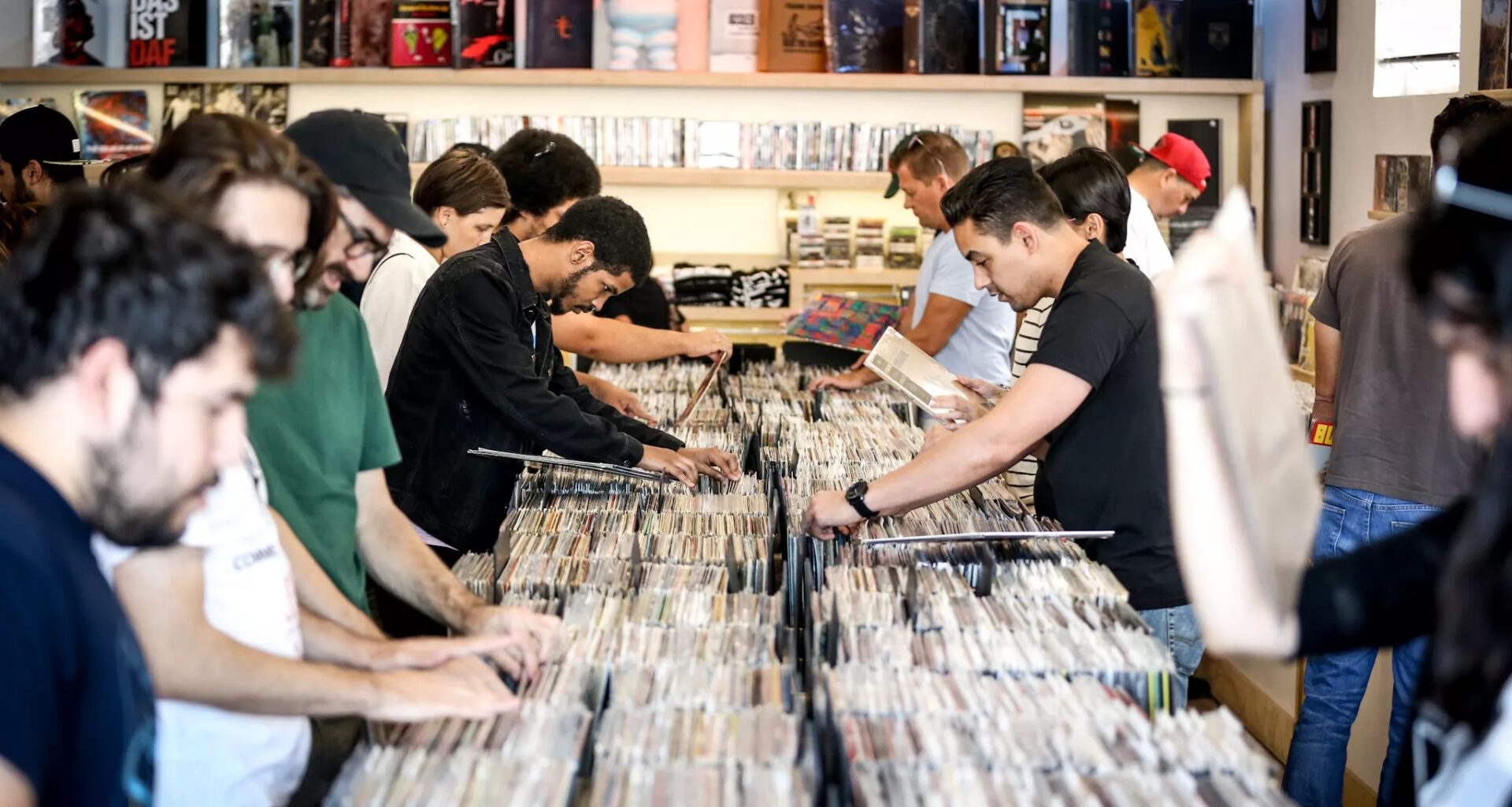 Photo of people buying vinyl records.