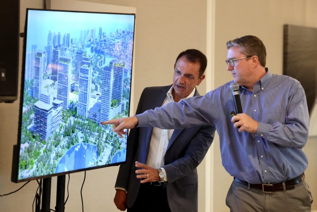 Fort Lauderdale Mayor Dean Trantalis and Director of Development Services Anthony Fajardo show the audience a rendering of the Galleria redesign during a town hall meeting at the Coral Ridge Yacht Club on Tuesday. (Mike Stocker/South Florida Sun Sentinel)