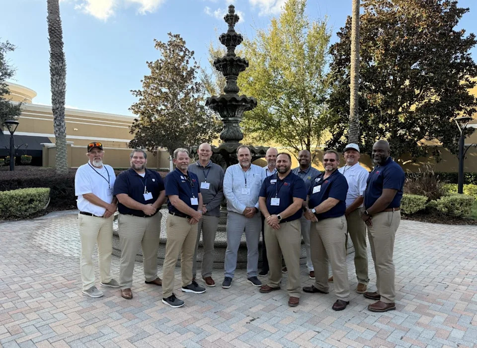 Jacksonville truck drivers Miguel Sanchez, second from left, and Demetrius "Dee" Hastings, fourth from right, were selected for the Florida Trucking Association's Florida Road Team that serves as industry ambassadors;