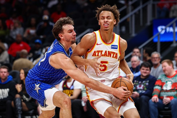 Orlando Magic forward Franz Wagner, left, defends against Atlanta Hawks guard Dyson Daniels (5) during the first half of an NBA basketball game on Tuesday night in Atlanta. (Colin Hubbard/Associated Press)