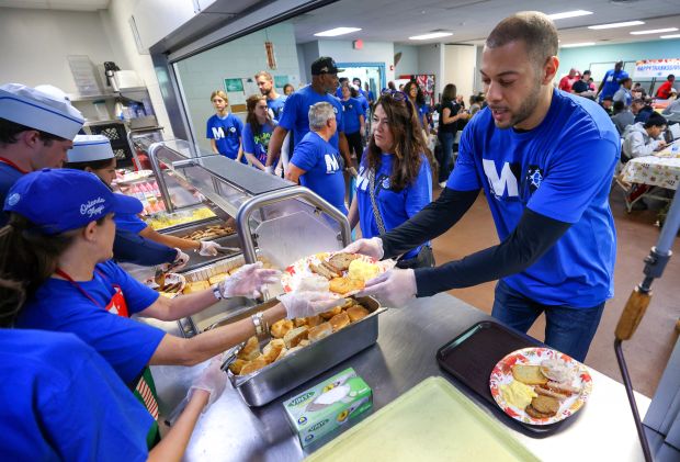 Team general manager Anthony Parker plates up to serve at the Orlando Magic 33rd Annual Thanksgiving Breakfast in partnership with the Coalition for the Homeless of Central Florida at their downtown campus on Thursday morning. (Joe Burbank/Orlando Sentinel)