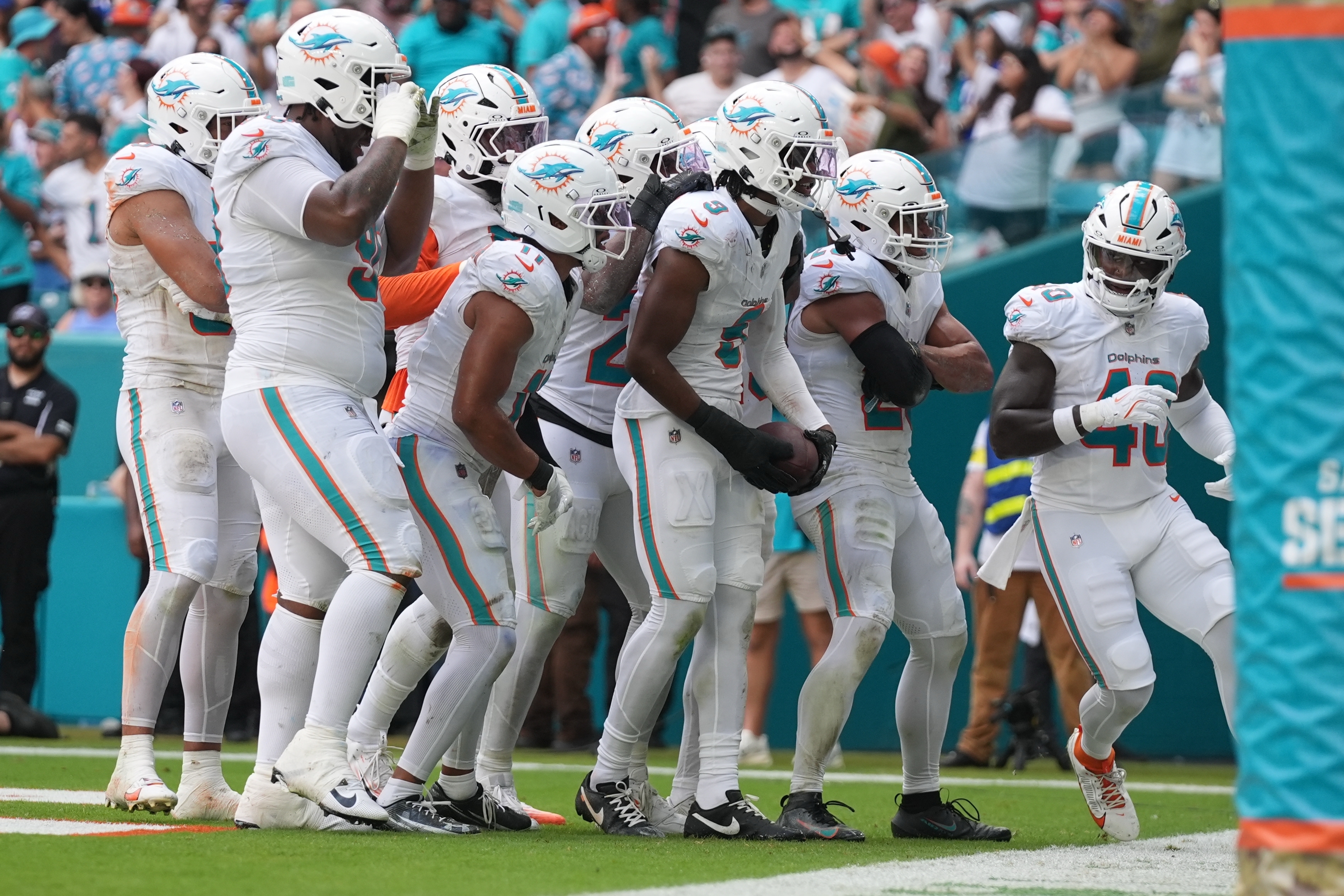 Miami Dolphins safety Ifeatu Melifonwu (9) celebrates an interception during the second half of an NFL football game against the Buffalo Bills, Sunday, Nov. 9, 2025, in Miami Gardens, Fla. (AP Photo/Lynne Sladky)