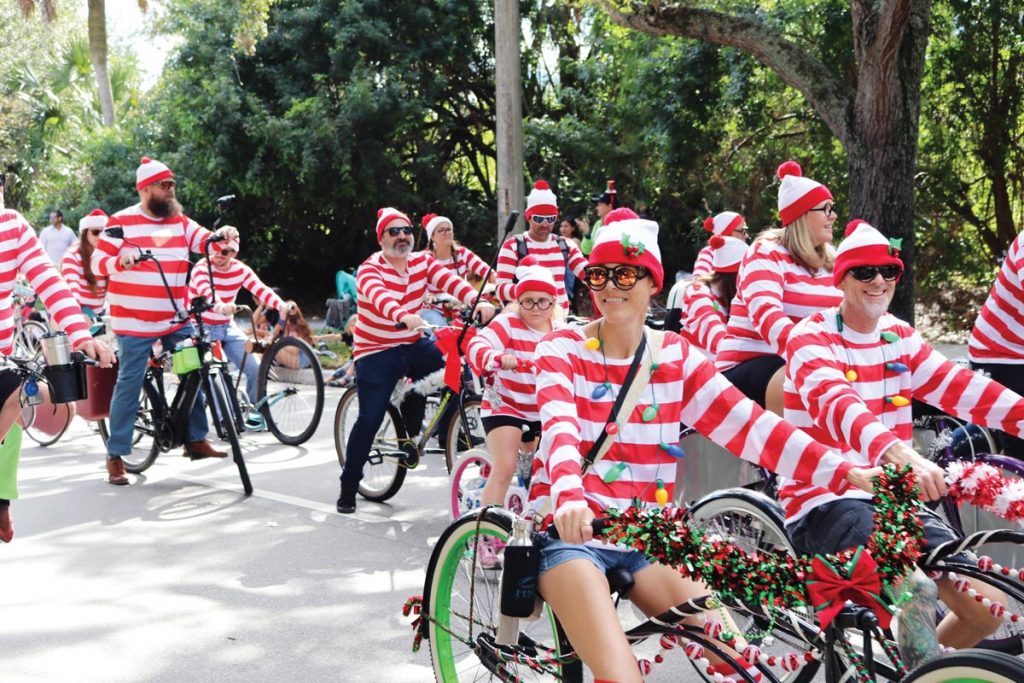 A host of Waldos parades through Jupiter on bicycles at the Jupiter/Tequesta Christmas Parade. Photo courtesy of The Jupiter Tequesta Athletic Association
