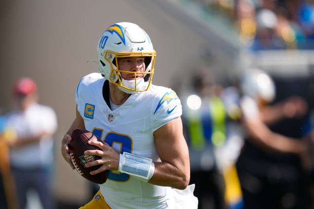 Chargers quarterback Justin Herbert looks to throw during the first...