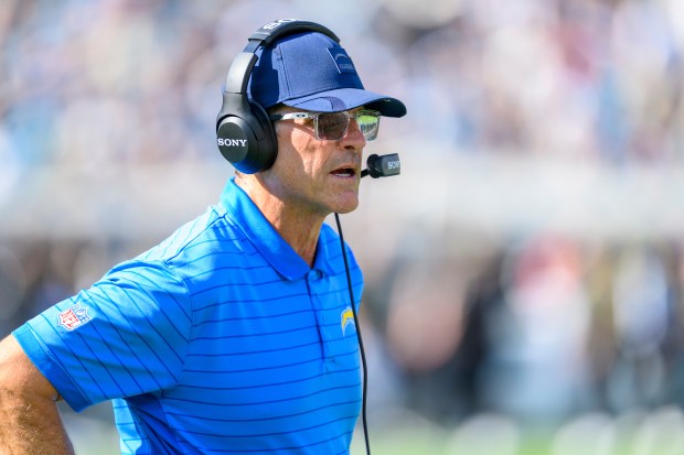 Chargers head coach Jim Harbaugh watched from the sidelines during...