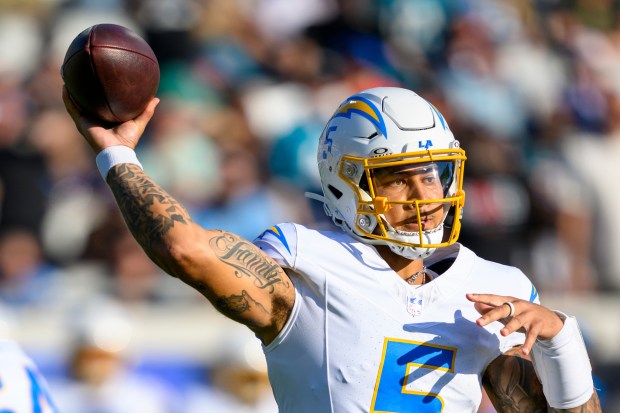 Chargers quarterback Trey Lance (5) throws the ball during an...