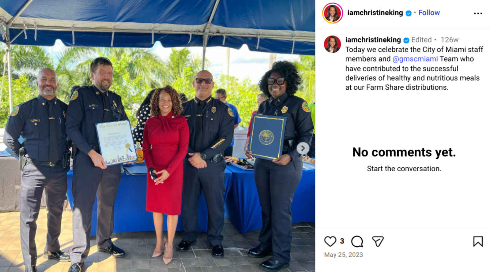Screenshot of Christine King's Instagram post, which shows King standing in the center wearing a read dress next to Police Chief Manuel Morales in his police uniform.