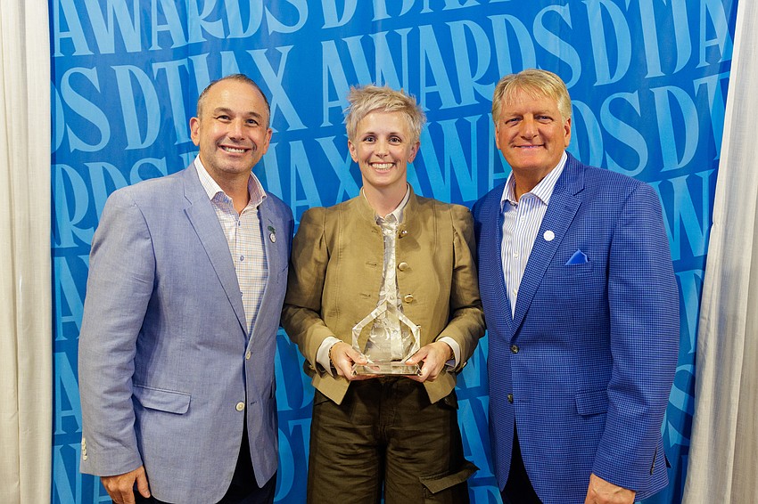The Greenhouse & Bar at 200 Riverside Ave. was named the Small Business of the Year at the 11th annual DTJax Awards. From left, Downtown Vision Inc. CEO Jake Gordon, bar owner Lauren Henry and DVI board chair Paul Davison.