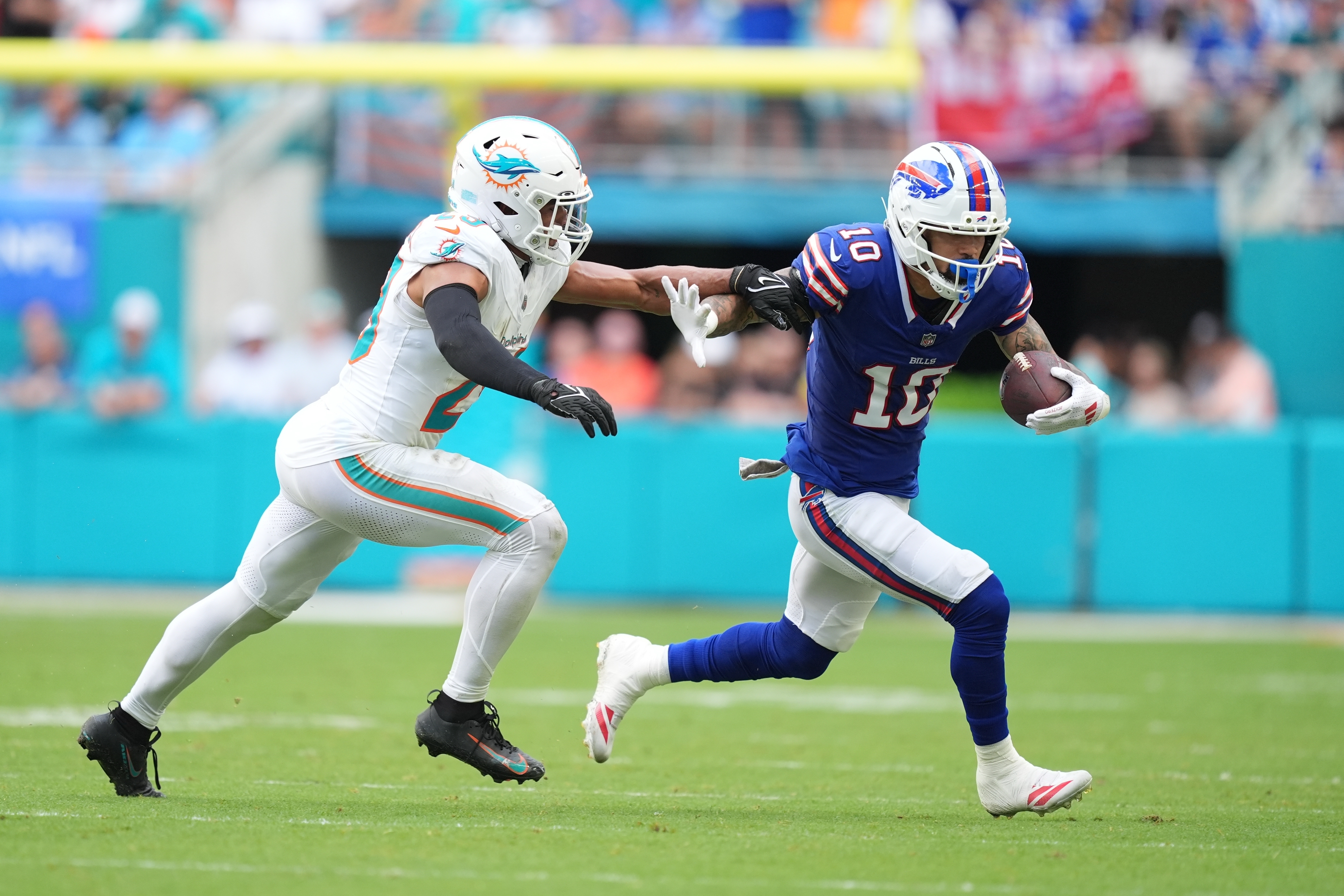 Buffalo Bills wide receiver Khalil Shakir (10) runs Miami Dolphins' Minkah Fitzpatrick against during the second half of an NFL football game, Sunday, Nov. 9, 2025, in Miami Gardens, Fla. (AP Photo/Rebecca Blackwell)