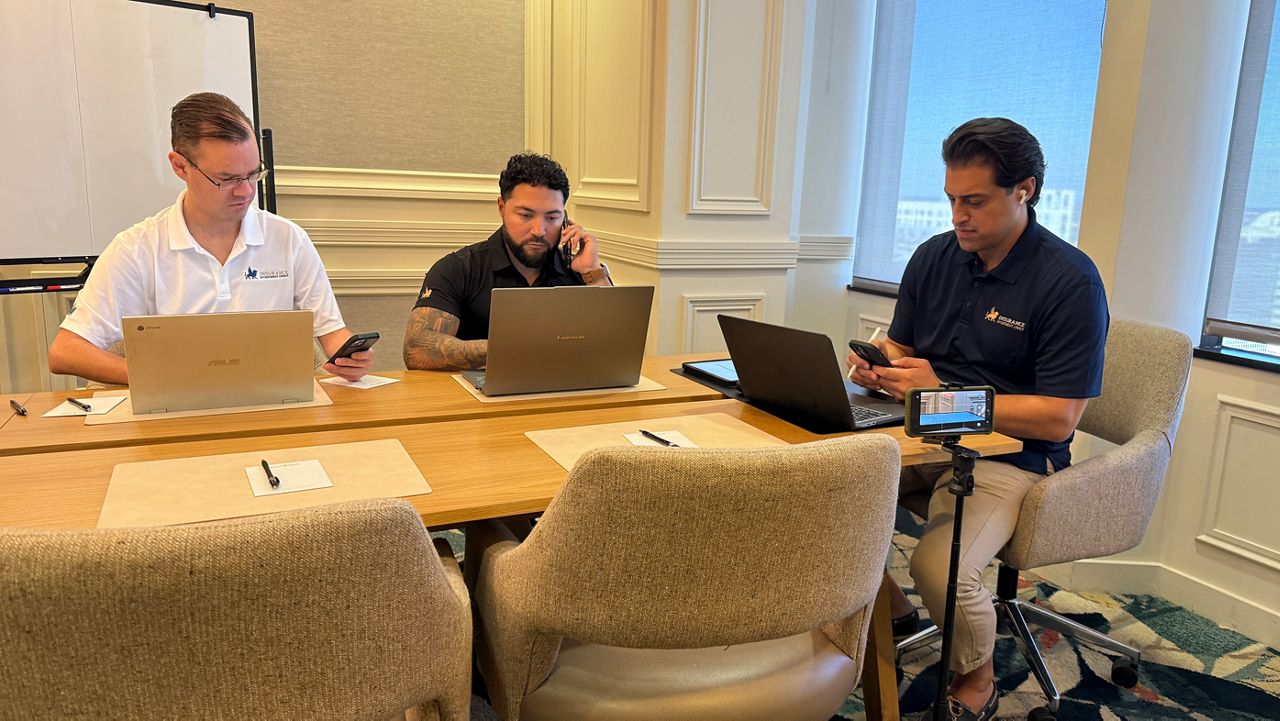 Insurance agents in Orlando work with customers to answer questions about Affordable Care Act health insurance coverage and premiums. (Spectrum News)