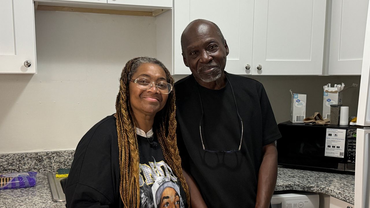 Jean and Willie Collins are ready to make memories and delicious dishes in the kitchen of their new apartment. The couple formerly slept on the 407 Connect buses operated by the Christian Service Center. (Spectrum News 13/Emma Delamo)