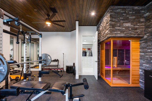 The primary wing includes his-and-hers walk-in closets and a home...