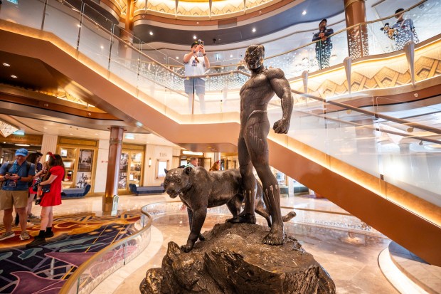 The Disney Destiny's Grand Hall features a Black Panther statue on Nov. 10, 2025. (Patrick Connolly/Orlando Sentinel)