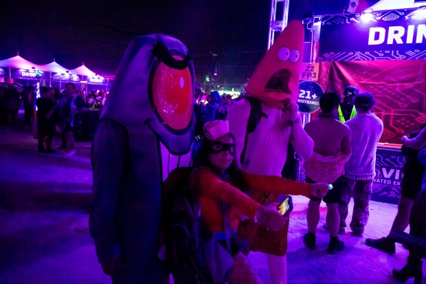 Festival attendees are dressed as characters from SpongeBob during EDC...