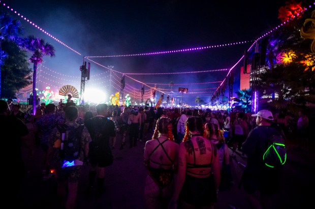 Festival-goers make their way down power path during EDC Orlando...