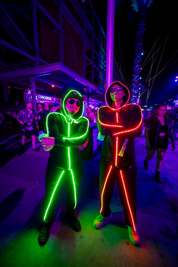 A pair of ravers wear light-up costumes during EDC Orlando...