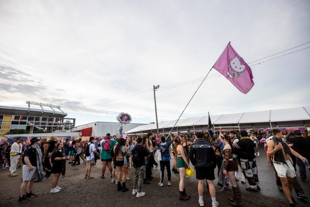 Festival-goers make their way into EDC Orlando during the final...