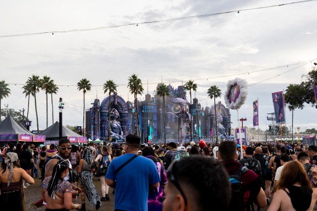 Festival-goers make their way into EDC Orlando during the final...