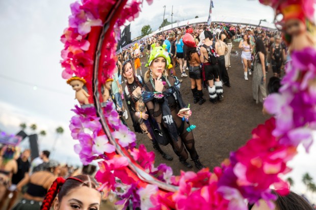 Festival-goers make their way into EDC Orlando, as seen in...