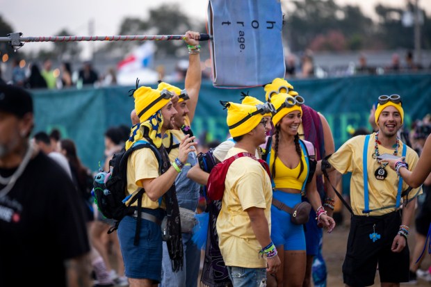Festival attendees are dressed as Minions during EDC Orlando at...