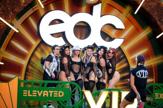 Festival attendees gathers for a group shot during EDC Orlando...