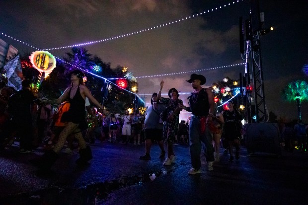 Festival-goers navigate Power Path during EDC Orlando at Tinker Field...