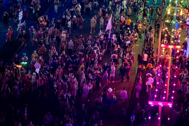 Tens of thousands of festival attendees walk around during EDC...