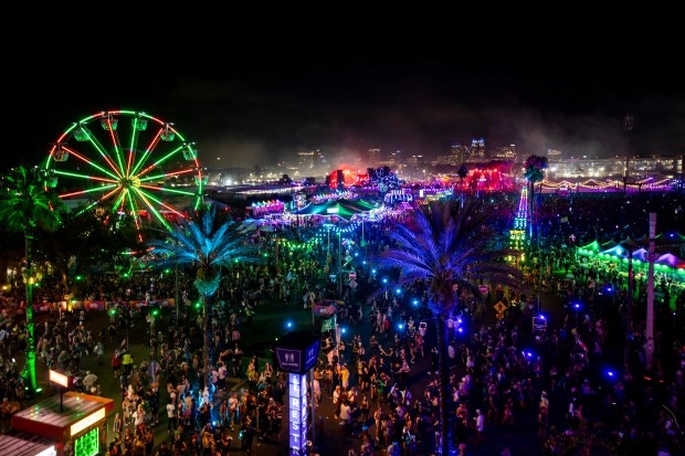 Tens of thousands of attendees pack into the grounds surrounding...