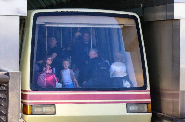 Passengers ride a 25-year-old Bombardier CX-100 tram into Airside 2 at Orlando International Airport, Thursday, Nov. 20, 2025.Upcoming tram replacement construction begins at OIA Dec. 3. The $253 million project will replace the aging older trains with brand new Mitsubishi Gate Link trams and will take two years to complete. (Joe Burbank/Orlando Sentinel)