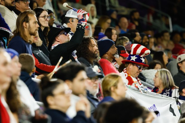 Fans in the supporter section keep tempo during the US...