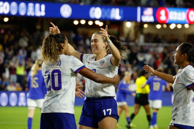 US Women's National Team midfielder Sam Coffey celebrates forward Catarina...
