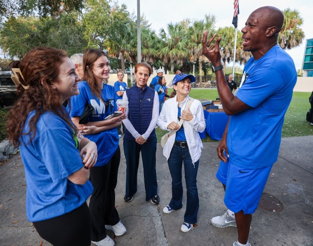 A THANKSGIVING TRADITION — Team ambassador Bo Outlaw talks to...