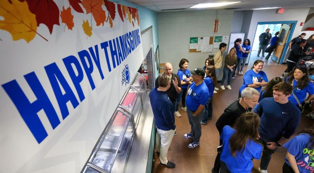 A THANKSGIVING TRADITION — Members of the Orlando Magic organization...