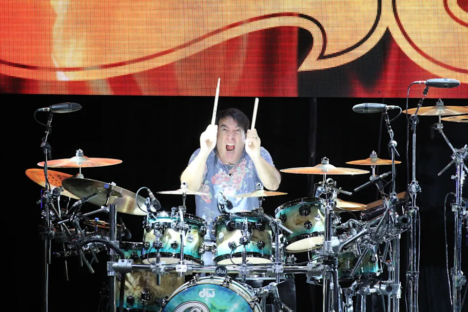 Walfredo Reyes Jr. plays the drums as the American rock band "Chicago" plays to a sold-out crowd at the St. Augustine Amphitheatre
