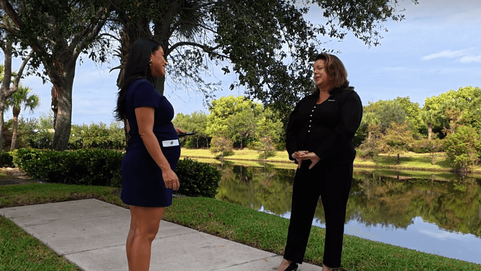 Jennifer Shiner, a Tradition resident, stands with CBS12 News Luli Ortiz during an interview about her daily 55-mile commute to West Palm Beach. “I do it because I love the firm where I work,” she said, reflecting on the limited high-paying job options in St. Lucie County. (WPEC)