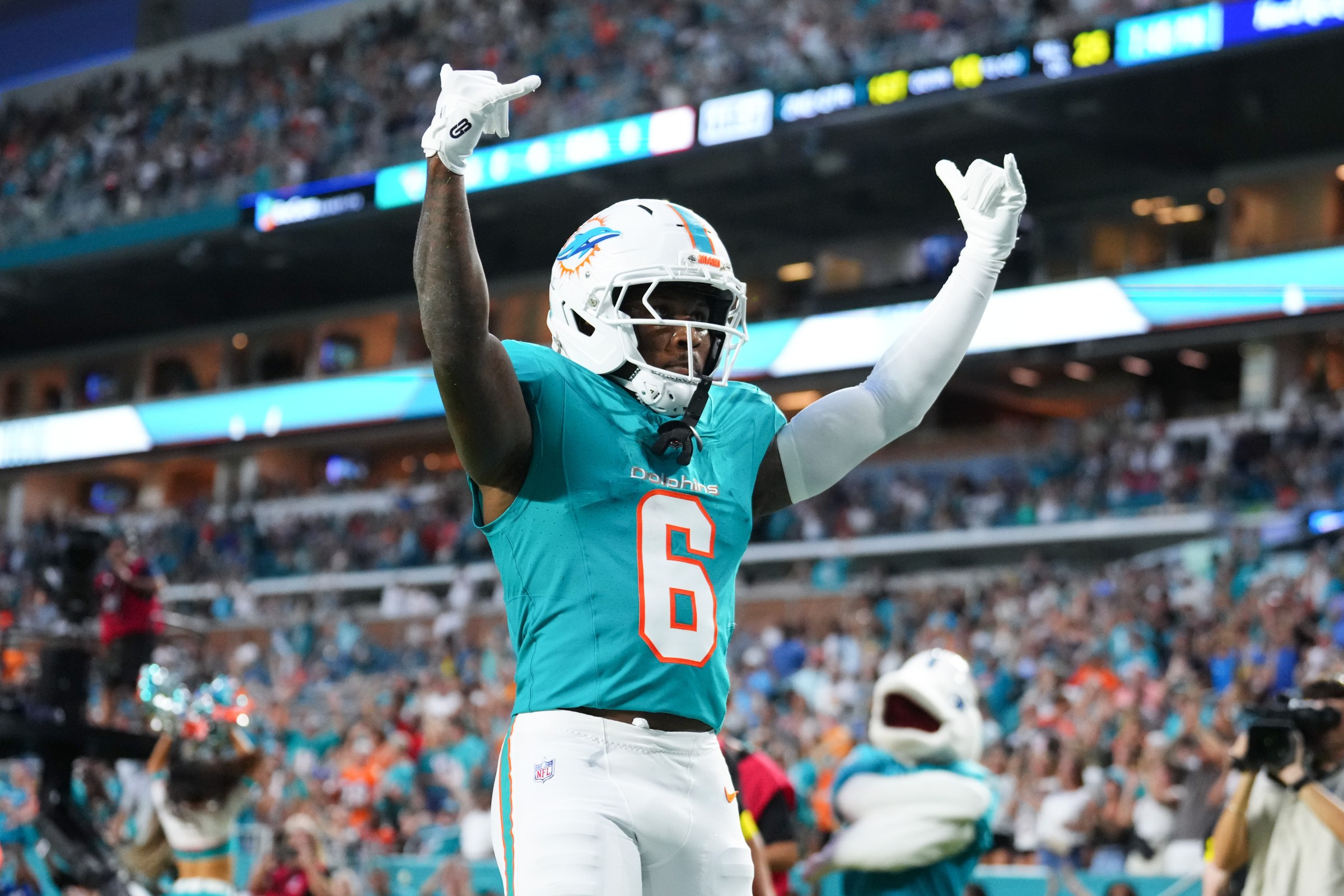 MIAMI GARDENS, FLORIDA - AUGUST 23: Malik Washington #6 of the Miami Dolphins celebrates after scoring a touchdown against the Jacksonville Jaguars during the second quarter of the NFL Preseason 2025 game between Jacksonville Jaguars and Miami Dolphins at Hard Rock Stadium on August 23, 2025 in Miami Gardens, Florida. (Photo by Rich Storry/Getty Images)