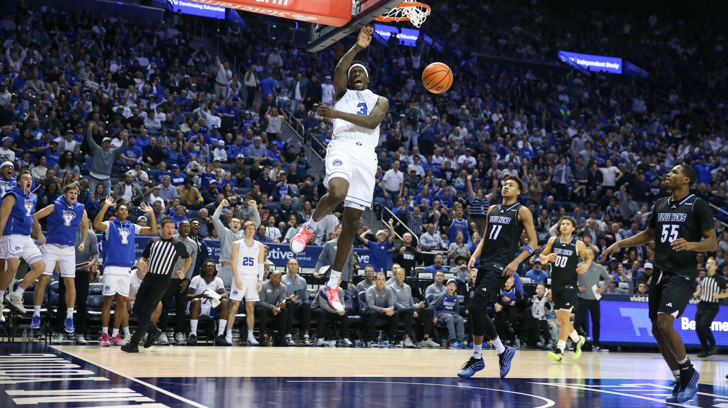 PROVO, UT - NOVEMBER 11: AJ Dybantsa #3 of the Brigham Young Cougars reacts after a dunk against Jayden Taylor #11, and Jameel Brown #55 of the Delaware Blue Hens during the second half of their game at the Marriott Center on November 11, 2025 in Provo, Utah. (Photo by Chris Gardner/Getty Images)