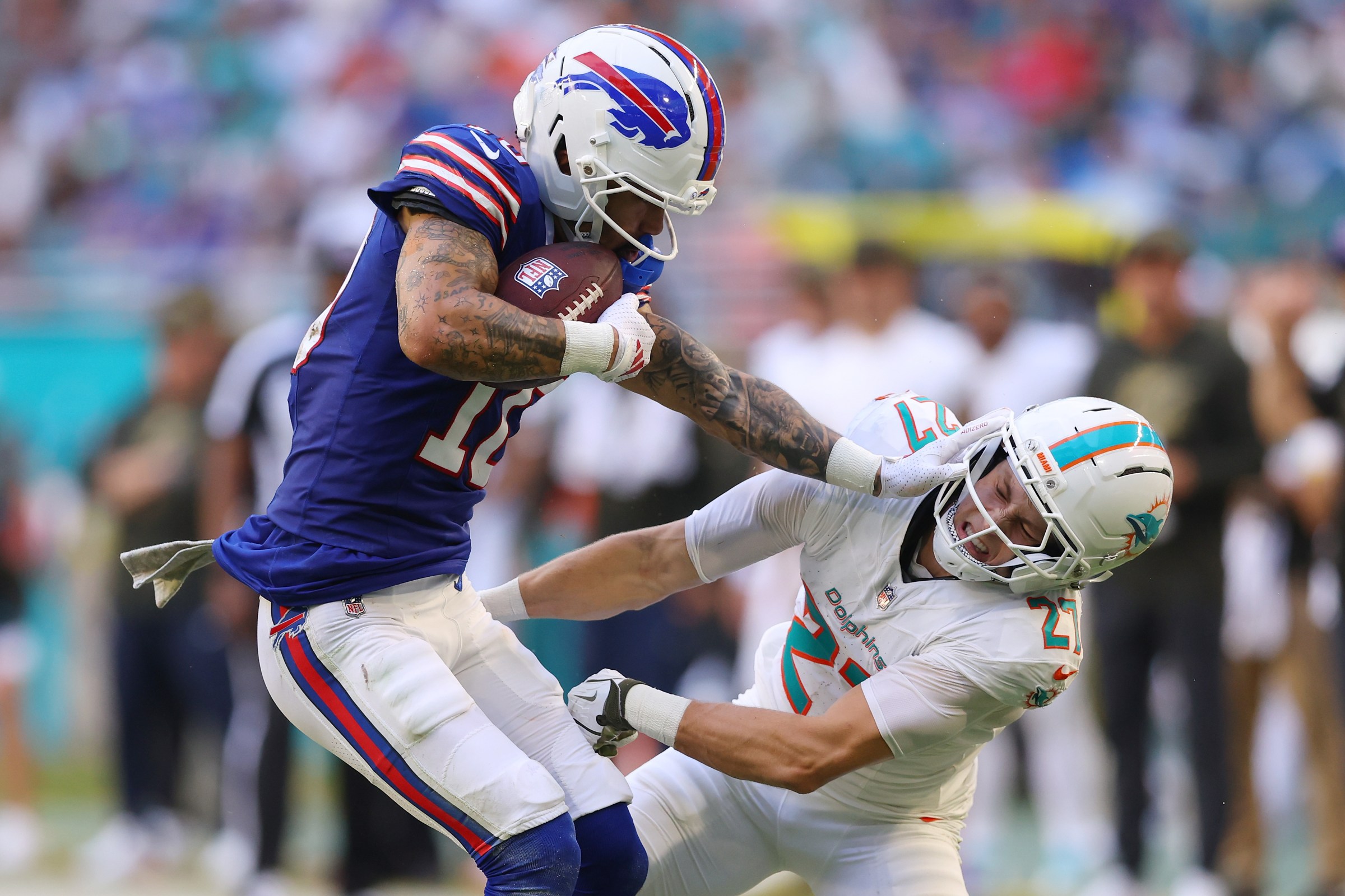 MIAMI GARDENS, FLORIDA - NOVEMBER 09: Khalil Shakir #10 of the Buffalo Bills carries the ball defended by Ethan Bonner #27 of the Miami Dolphins during the fourth quarter in the game at Hard Rock Stadium on November 09, 2025 in Miami Gardens, Florida. (Photo by Megan Briggs/Getty Images)