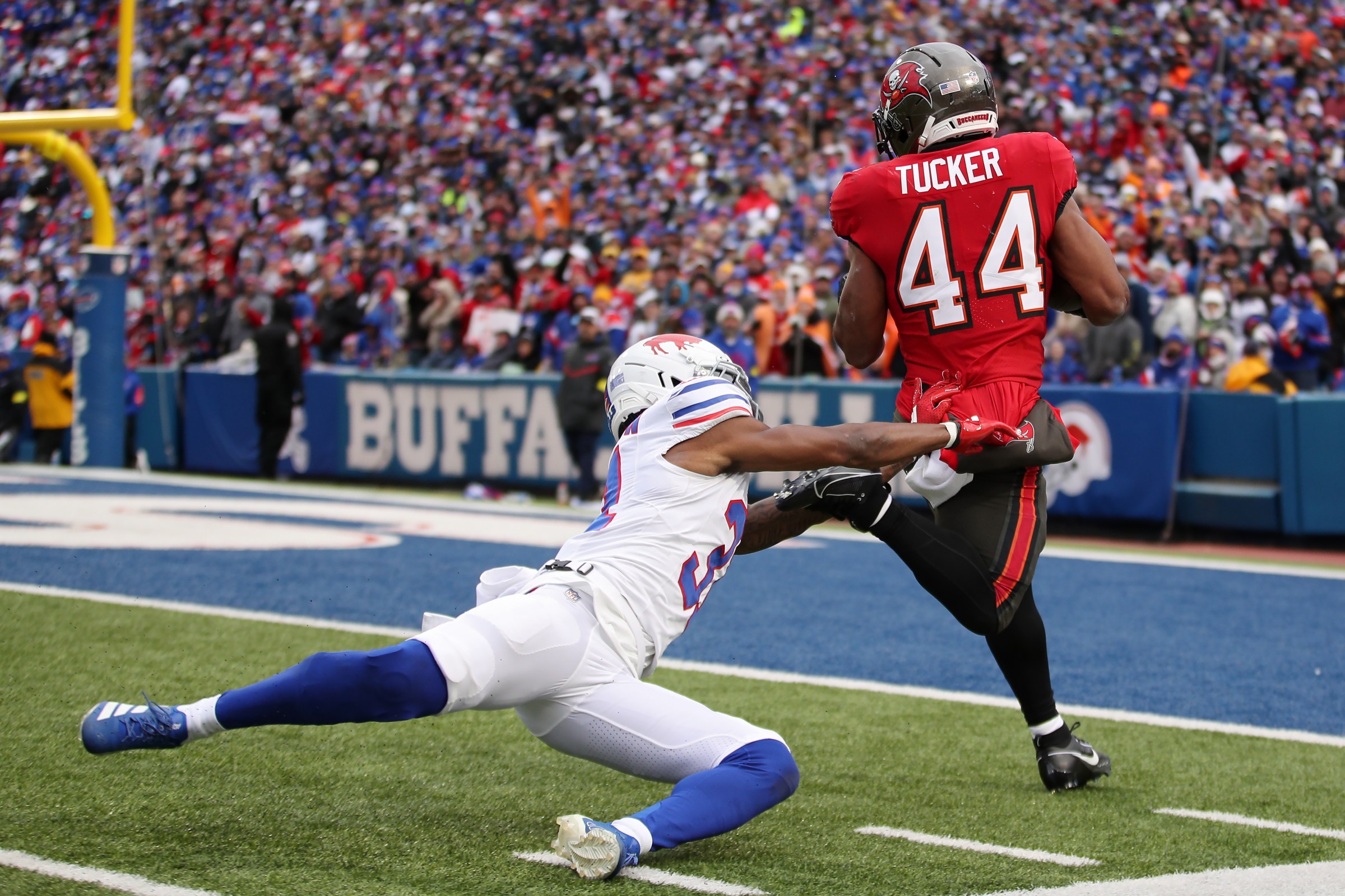 ORCHARD PARK, NEW YORK - NOVEMBER 16: Sean Tucker #44 of the Tampa Bay Buccaneers runs the ball for a touchdown against Maxwell Hairston #31 of the Buffalo Bills during the second quarter at Highmark Stadium on November 16, 2025 in Orchard Park, New York. (Photo by Bryan M. Bennett/Getty Images)