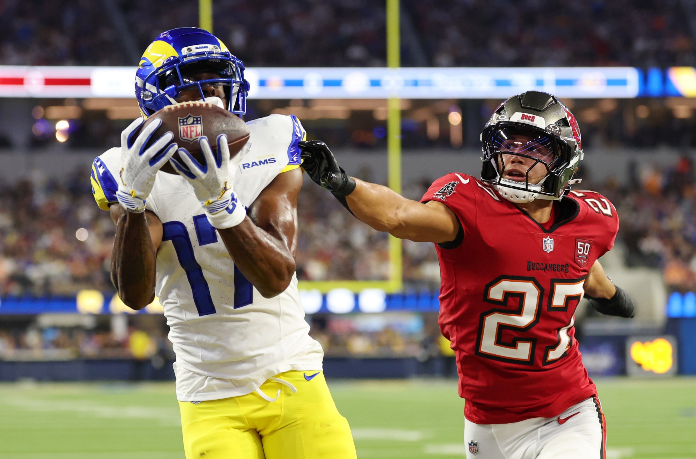 INGLEWOOD, CALIFORNIA - NOVEMBER 23: Davante Adams #17 of the Los Angeles Rams catches a touchdown pass against Zyon McCollum #27 of the Tampa Bay Buccaneers during the first quarter in the game at SoFi Stadium on November 23, 2025 in Inglewood, California. (Photo by Sean M. Haffey/Getty Images)