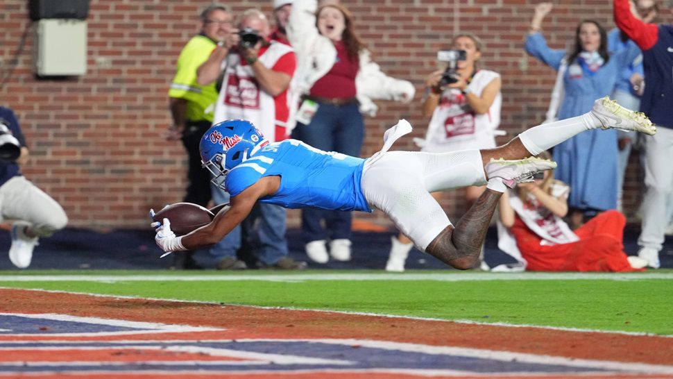 Mississippi wide receiver De'Zhaun Stribling dives into the end zone with a 43-yard touchdown pass reception during the first half of an NCAA college football game against Florida, Saturday, Nov. 15, 2025, in Oxford, Miss. (AP Photo/Rogelio V. Solis)