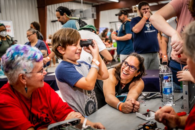 One exhibit at Maker Faire Orlando allows attendees to take things apart to see how they work. (Roberto Gonzalez/Courtesy of Maker Faire Orlando)