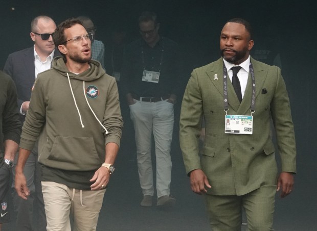Miami Dolphins head coach Mike McDaniel and interim general manager...