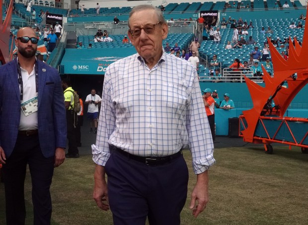 Miami Dolphins owner Stephen Ross walks onto the field before...