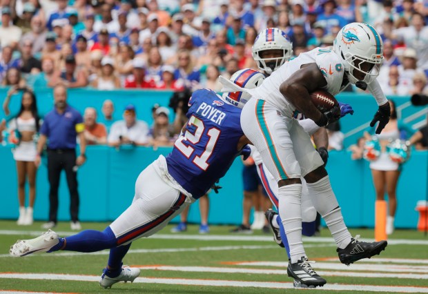 Miami Dolphins wide receiver Malik Washington catches a touchdown past...
