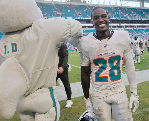 Miami Dolphins running back De'Von Achane leaves the field after...