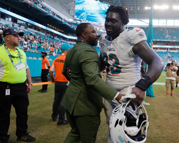 Miami Dolphins interim general manager Champ Kelley celebrates with Miami...
