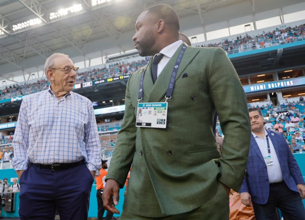 Miami Dolphins owner Stephen Ross and interim general manager Champ...